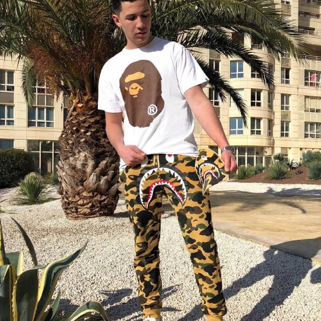 The pants yellow BAPE that is on the influencer Amir Lzn on his ...