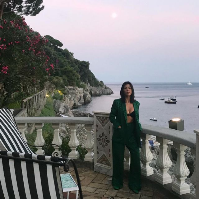 Kourtney Kardashian's high-waisted green jacquard trousers on her Instagram account