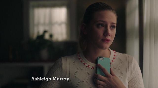 The sweater is white with red crosses on the collar, Carven of Betty Cooper (Lili Reinhart) in Riverdale S02E22