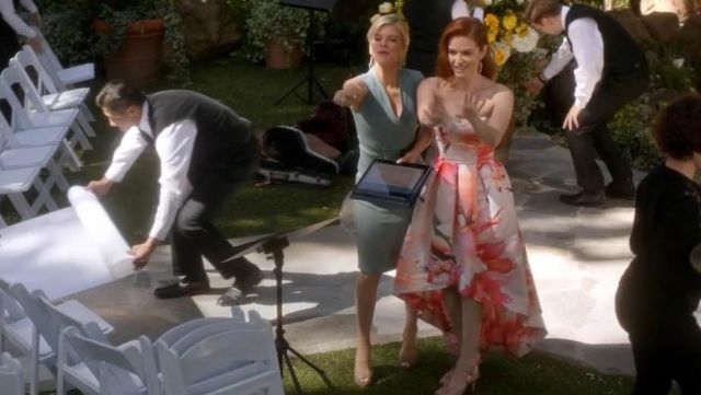 The dress was pastel pink and white for April Kepner Sarah Drew