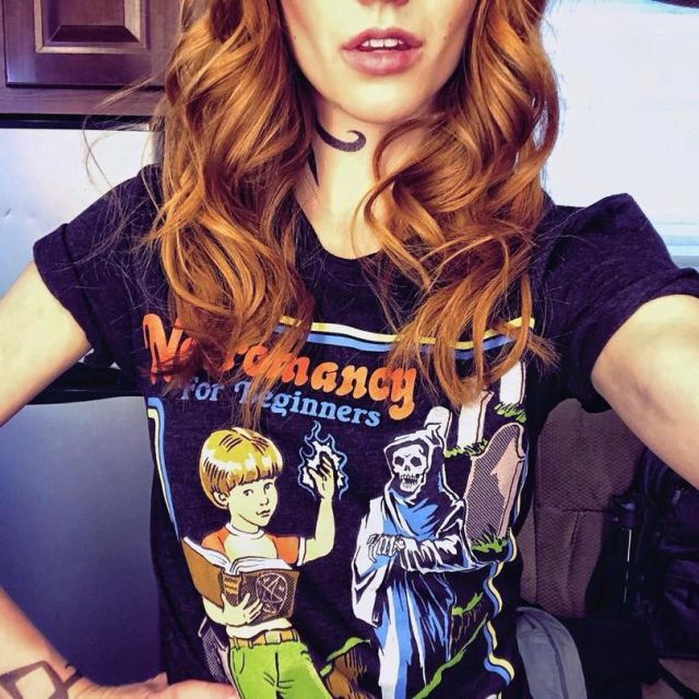 The Slogan Tee shirt "Necromancy for beginners" worn by Katherine McNamara on Instagram