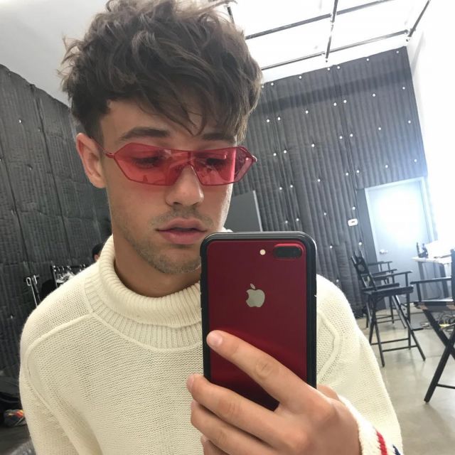 The smartphone iPhone 8 + Red Apple that is used by Cameron Dallas on his account Instagram