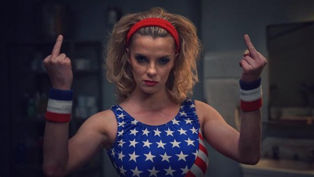 Liberty Belle / Debbie Eagan's USA color wristbands  (Betty Gilpin) in GLOW