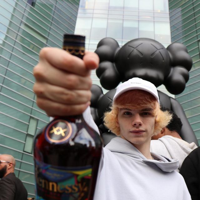 The bottle Kaws x Hennessy that holds in his hand the youtubeur'connor TV on his account instagram