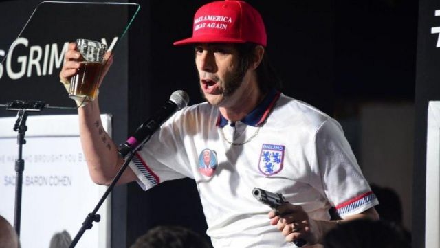 The red cap's "Make America Great Again" by Sacha Baron Cohen in Who is America.