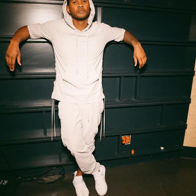 The pair of Adidas Pw Hu Holi Nmd Bc "Cream" worn by Usher on his account Instagram