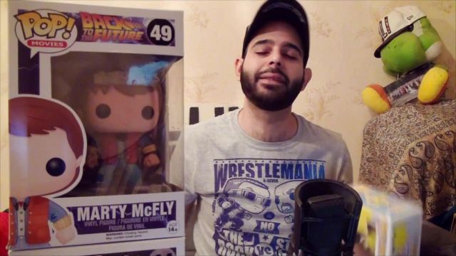 The funko pop Marty Mcfly in Back to the future wrestling club in the video My Collection: 50 Funko Pop! (WWE, DBZ, GoT, Marvel, Friends, etc...)