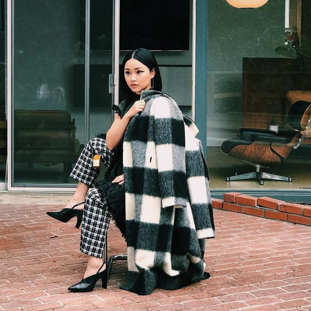 The coat plaid black and white worn by Lana Condor on his account Instagram @lanacondor