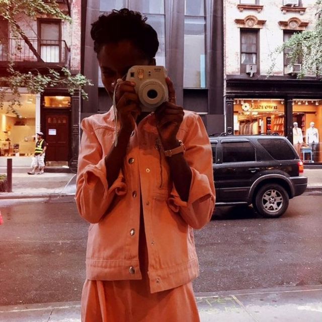 The jean jacket orange worn by Letitia Wright on his account Instagram