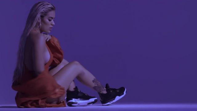 Nike Air Jordan 4 Retro "Royalty" worn by Karol G in her Ahora Me Llama music video with Bad Bunny