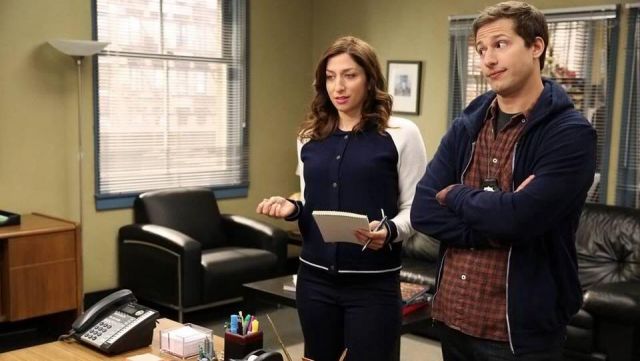 The jacket in blue and white worn by Gina Linetti (Chelsea Peretti) on Brooklyn Nine-Nine S01E18