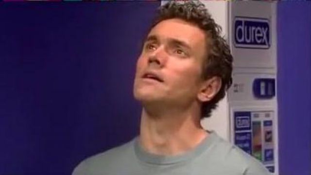 Durex Condom Vending Machine behind Patrick Maitland (Ben Miles) as seen in Coupling (S02E04)