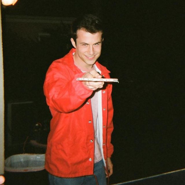 Red Coatch Jacket of Dylan Minnette on the Instagram account @dylanminnette