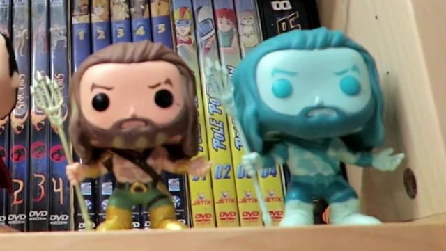 The figurine Funko Pop! Aquaman Glow in the dark of Modzii in his video THE biggest COLLECTION OF FIGURINES POP! OF FRANCE !