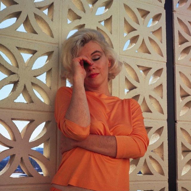 The Top Orange Worn By Marilyn Monroe During A Photo Shoot