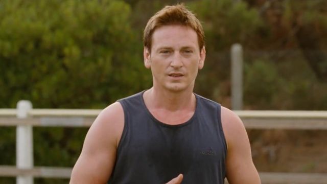 The tank top in black worn by Vincent Ribaud (Benoît Magimel) in The Small Handkerchiefs