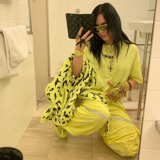 The hoody yellow with black designs of Billie Eilish on the account ...