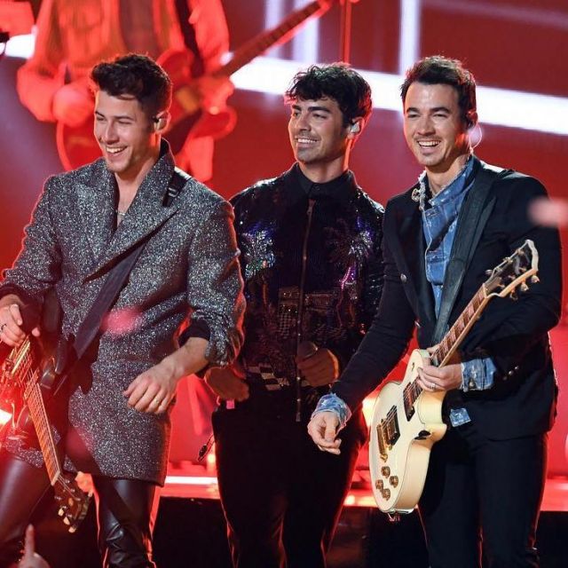 Balmain embossed button blazer worn by Kevin Jonas  for Billboard Music Awards May 1, 2019