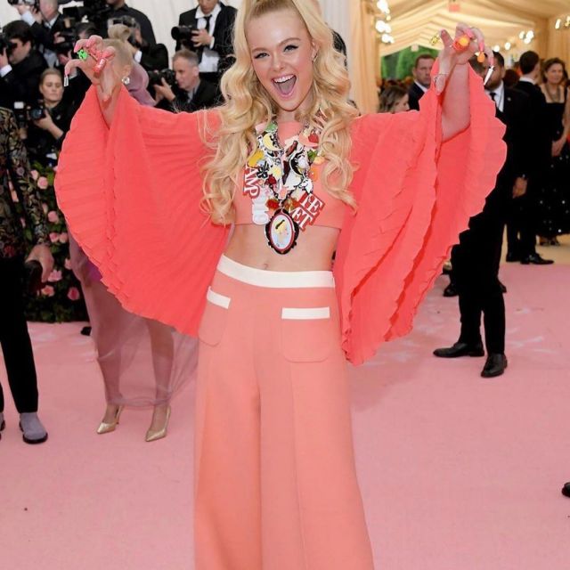 The orange pants off of Elle Fanning on the account instagram @themetgalaofficial