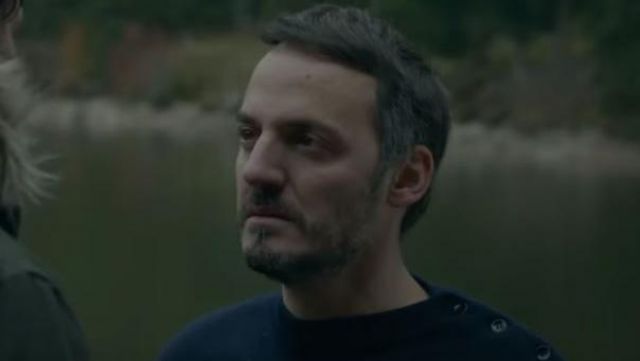 The black sweater with buttons on the shoulder worn by David (Fabrizio Rongione) in A dark