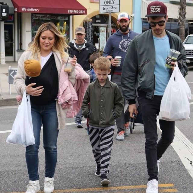 Saint Laurent High Top White Sneakers worn by Hilary Duff at Farmer's Market May 26, 2019