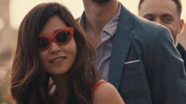Red sunglasses worn by Alice (Maya Erskine) in Plus One