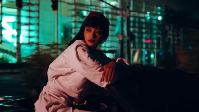 White bomber jacket worn by a woman as seen in Callaíta music video by Bad Bunny