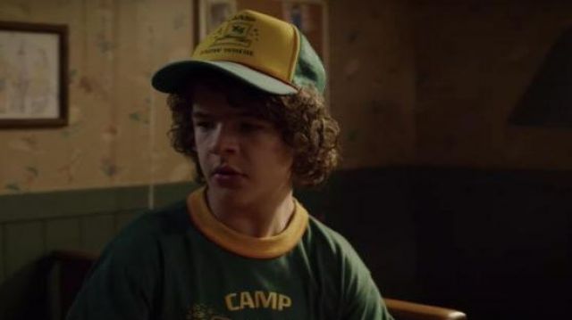 The cap-Camp "85" Know Where" by Dustin Henderson (Gaten Matarazzo) in Stranger Things Season 3 Episode 1