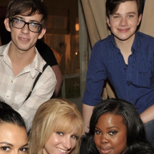 The shirt navy blue worn by Chris Colfer on a promotional photo of Glee