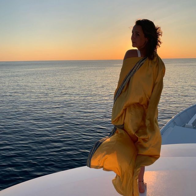 The kimono is yellow with printed ornaments on the sleeves worn by Pauline Ducruet on the account instagram of @paulinedcrt