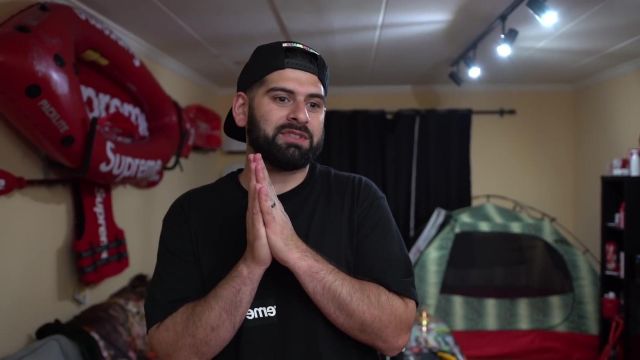 Kayaking red Supreme QrewTv in the video OMG THIS $500K SNEAKER COLLECTION IS INSANE!! *MUST SEE*