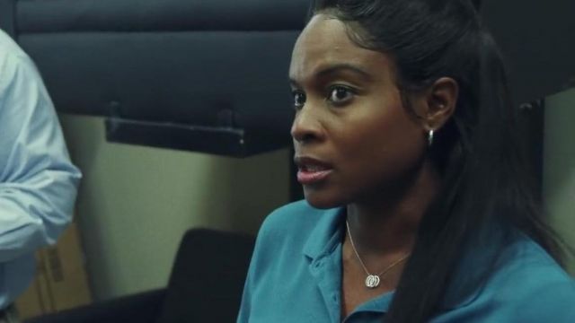 The collar ring of Michelle Obama's (Tika Sumpter) seen in South Side (S01E02)