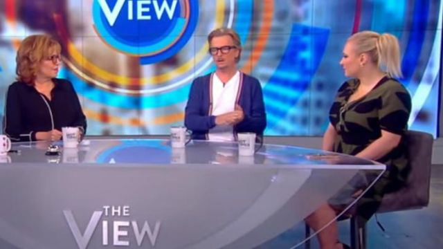 Green and black printed flower dress worn by Meghan McCain on The View JULY 29, 2019
