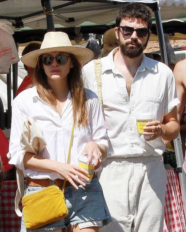 The Row Yellow Top Zip Crossbody Bag worn by Elizabeth Olsen With Robbie Arnett August 11, 2019