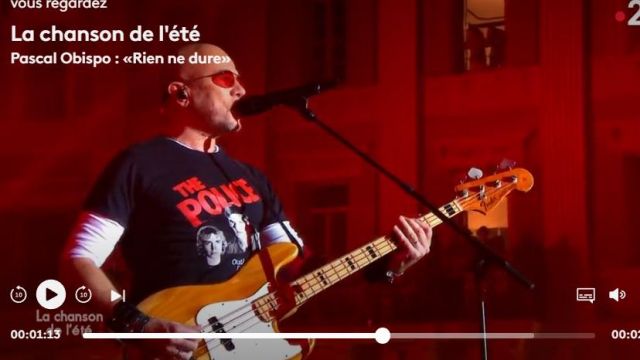 The tee shirt is black The Police of Pascal Obispo in The Song of the summer of the 21.08.2019