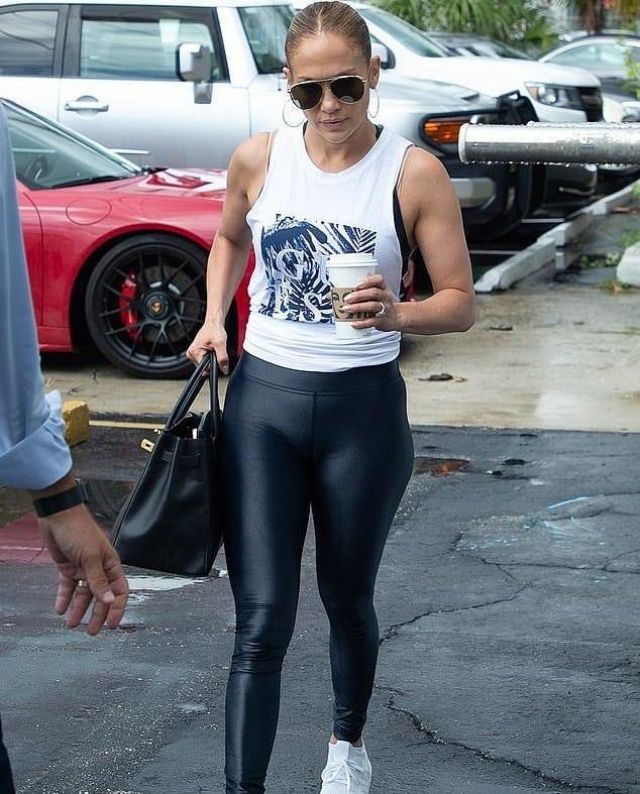 Guess Palm Print Logo Tank worn by Jennifer Lopez Miami August 22, 2019