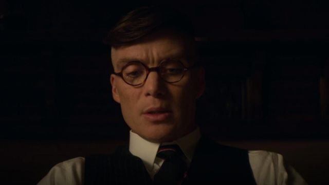 The round glasses way scales Thomas Shelby (Cillian Murphy) in Peaky Blinders Season 5 Episode 1