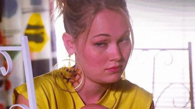Gold circle dangle earrings with eye design inside worn by Carly Carlson (Kelli Berglund) as seen in Now Apocalypse (S01E03)