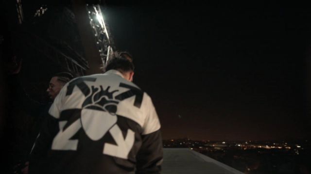 The black leather jacket and white worn By N. O. S. in the clip, The DD of NLP