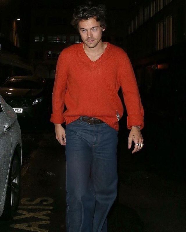 Gucci Washed Denim Flare Pants worn by Harry Styles Dinner in London September 28, 2019