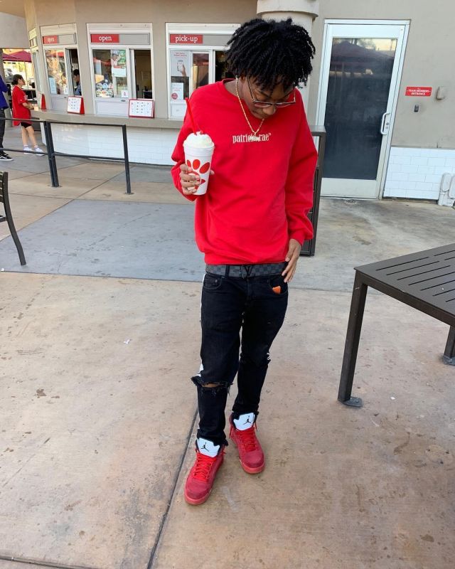 The Sneakers Jordan 5 Retro Red Suede worn by Lil Tecca account on the Instagram of @liltecca
