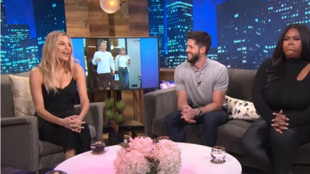Cinq à sept black feath­er-trimmed crêpe top worn by Morgan Stewart on E! News October 15, 2019