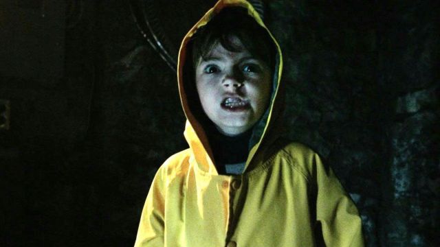 The waxed yellow worn by the child (Jackson Robert Scott) in It