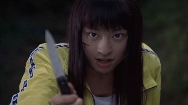 Le survêtement jaune Asics de Takako Chigusa - Onna 13-ban (Chiaki Kuriyama) dans le film Battle Royale