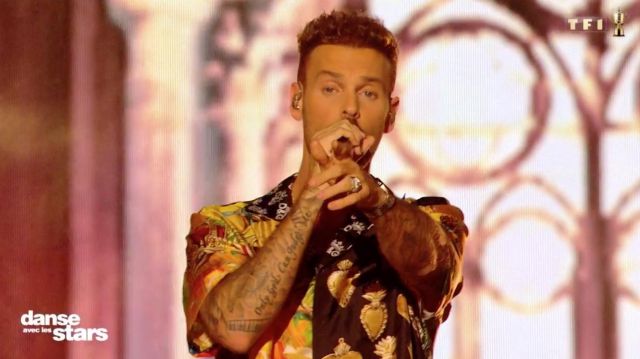 The shirt is yellow and black printed Dolce & Gabbana worn by M. Pokora in Dancing with the Stars