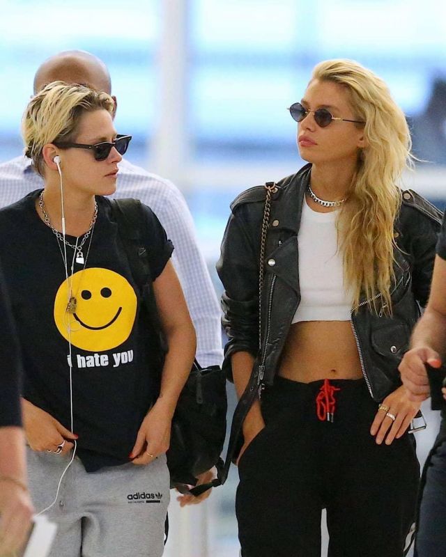 I Hate You Smile emoji T-Shirt in black worn by Kristen Stewart arriving at JFK Airport in New York