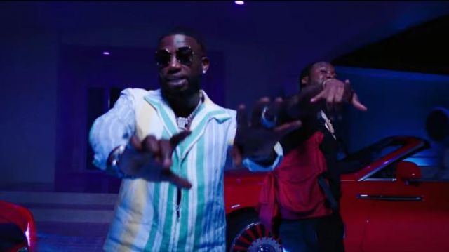 A Cold Wall Red Mil­i­tary Har­ness worn by Meek Mill in the YouTube video Gucci Mane - Backwards feat. Meek Mill [Official Music Video]