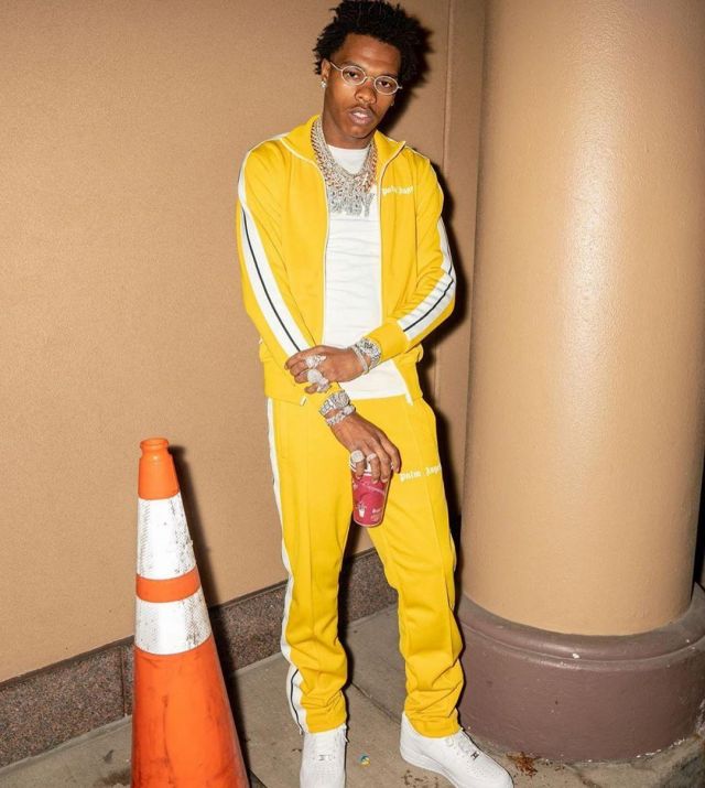 Palm Angels Side Stripe Yel­low Track Jack­et of Lil Baby on the Instagram account @lilbaby