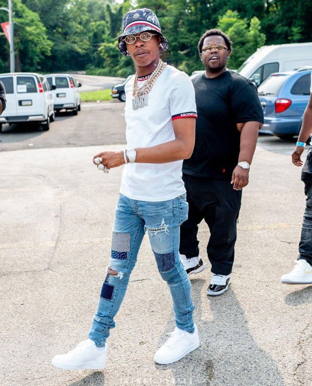 Amiri Blue Japan­ese Re­pair Jeans of Lil Baby on the Instagram account @lilbaby_1