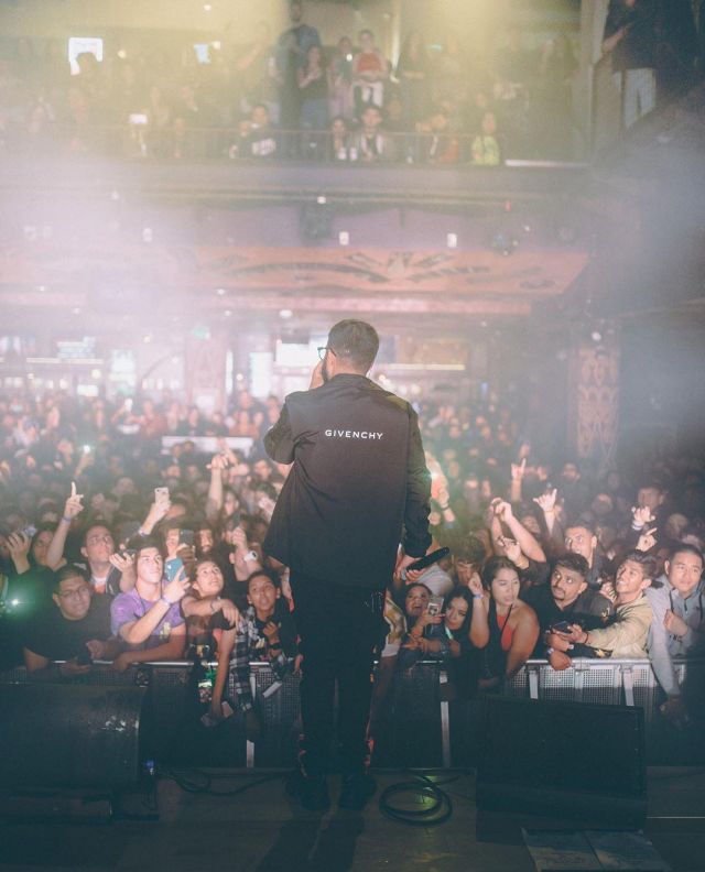 Givenchy Black Lo­go Patch Coat of Nav on the Instagram account @nav